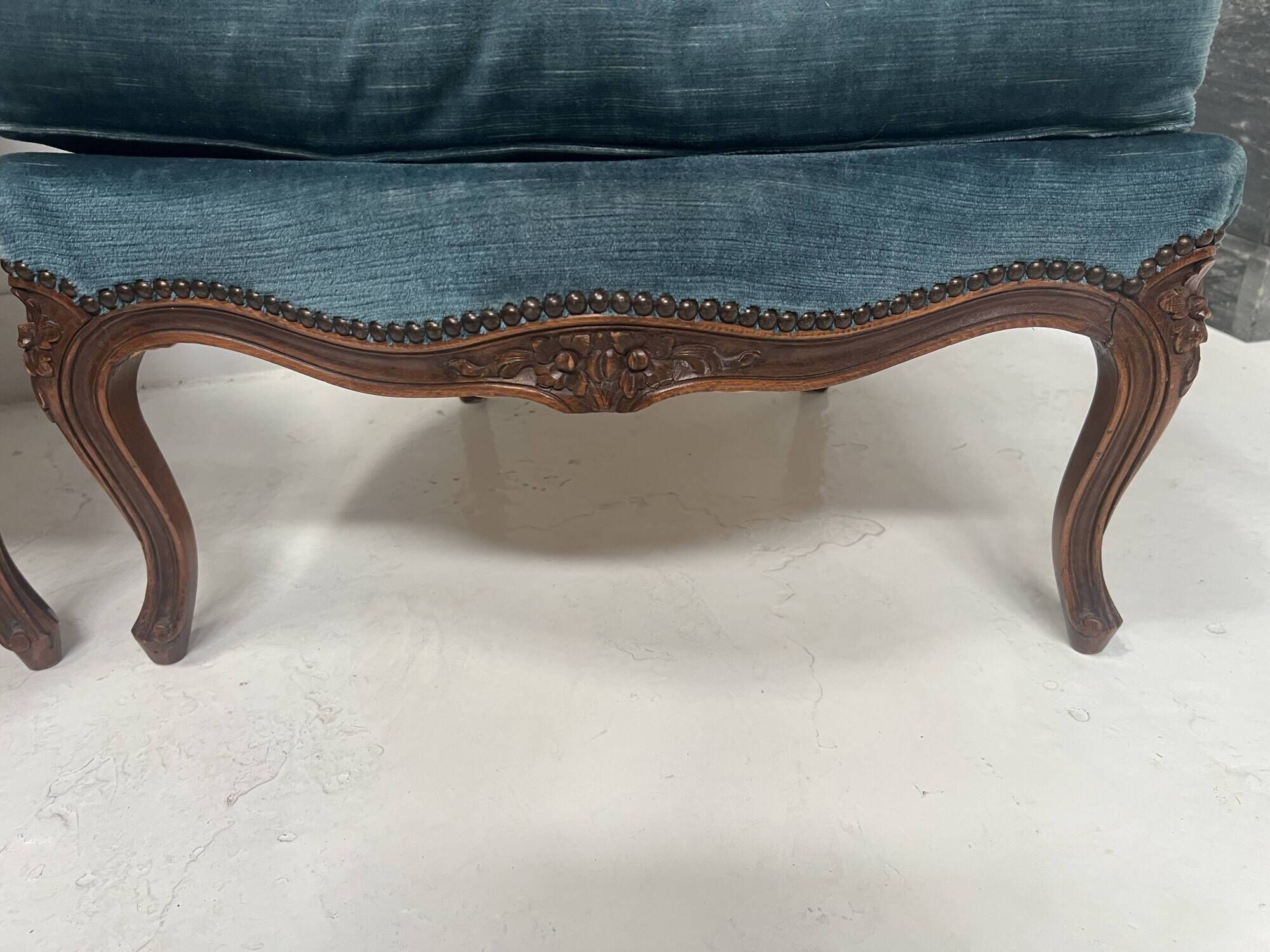 Pair of Louis XV style armchairs in natural wood, 20th century.