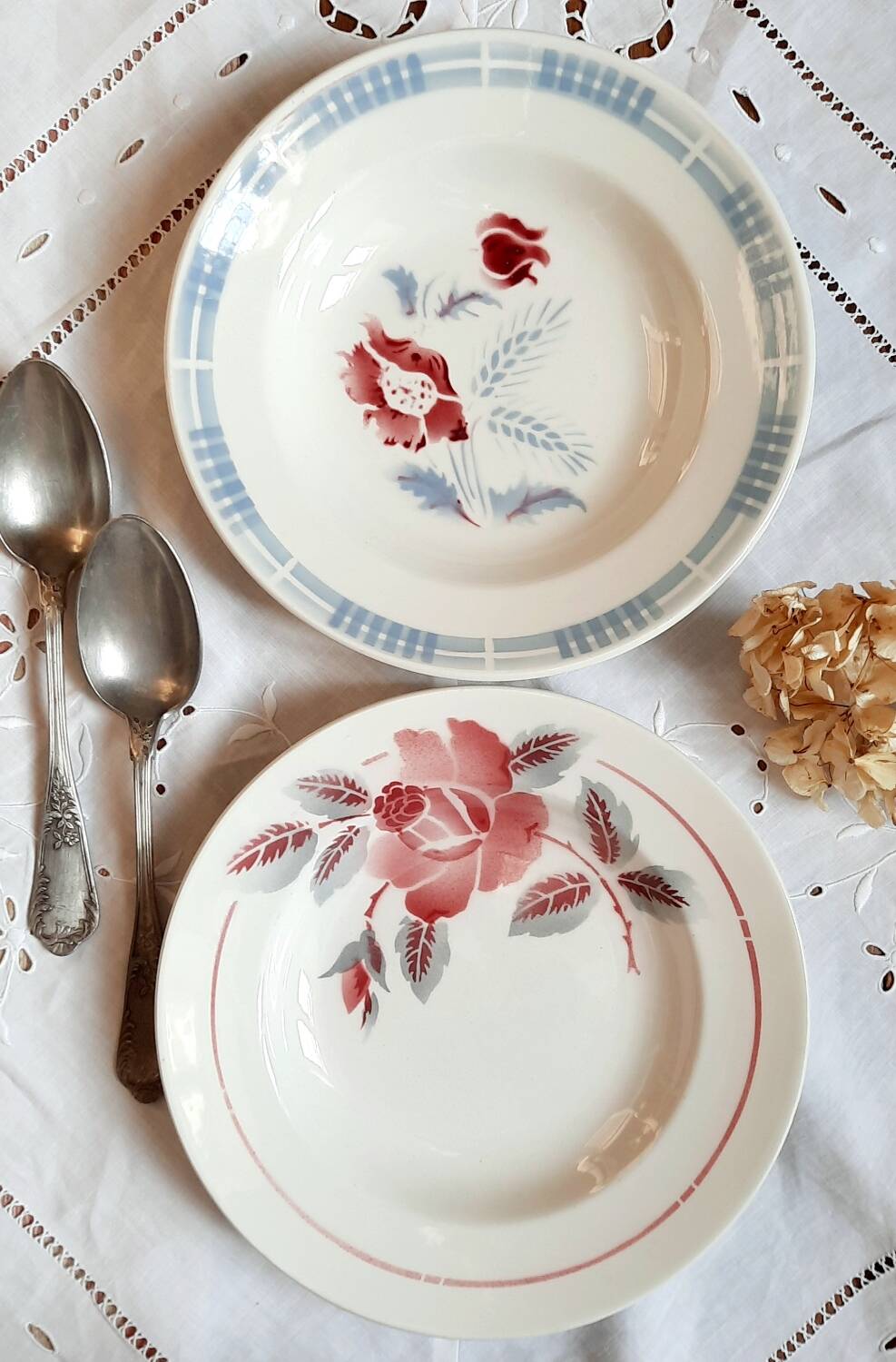 Mismatched old soup plates accompanied by a soup tureen