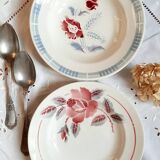 Mismatched old soup plates accompanied by a soup tureen