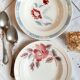 Mismatched old soup plates accompanied by a soup tureen