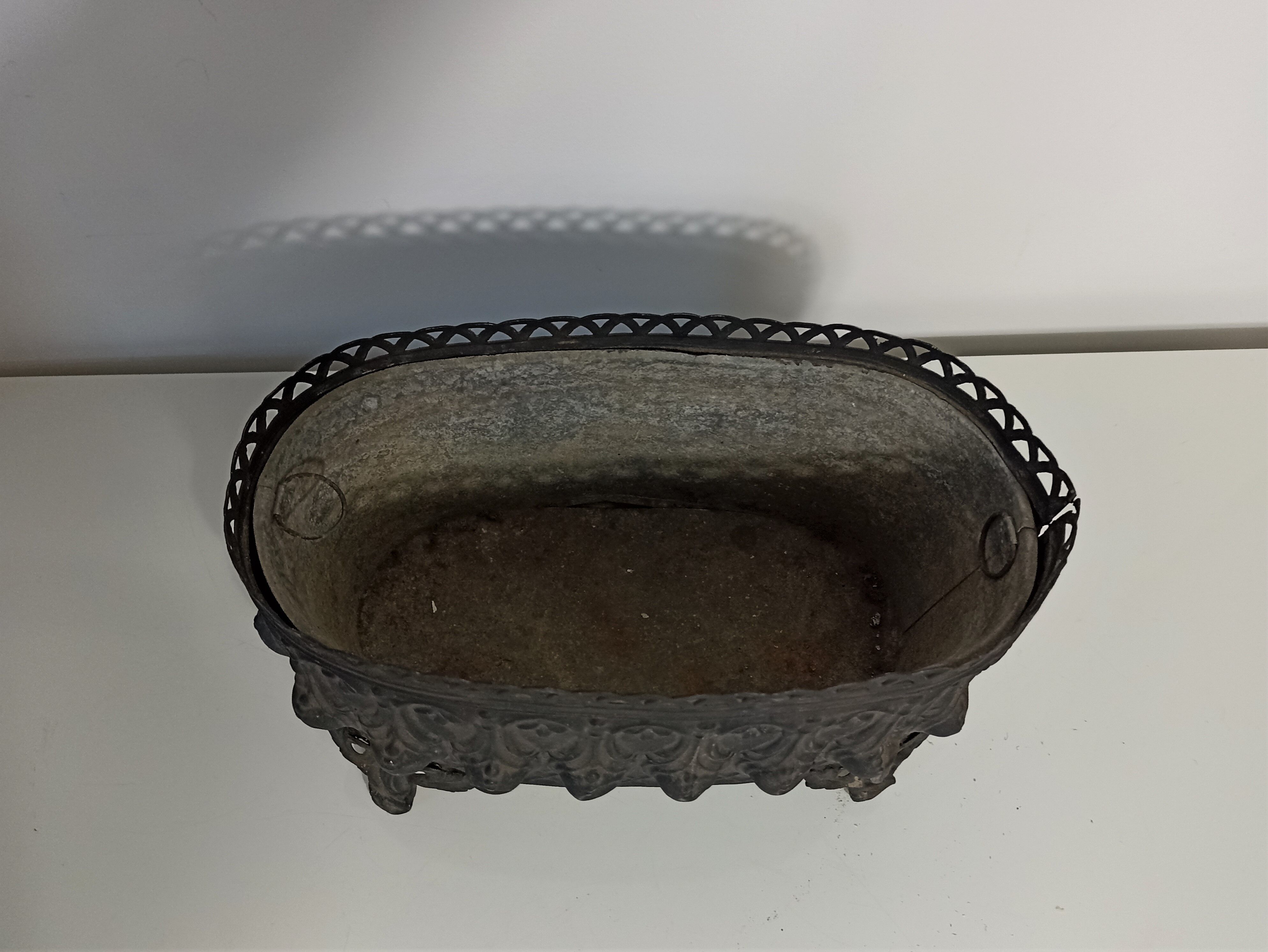 Old black iron planter