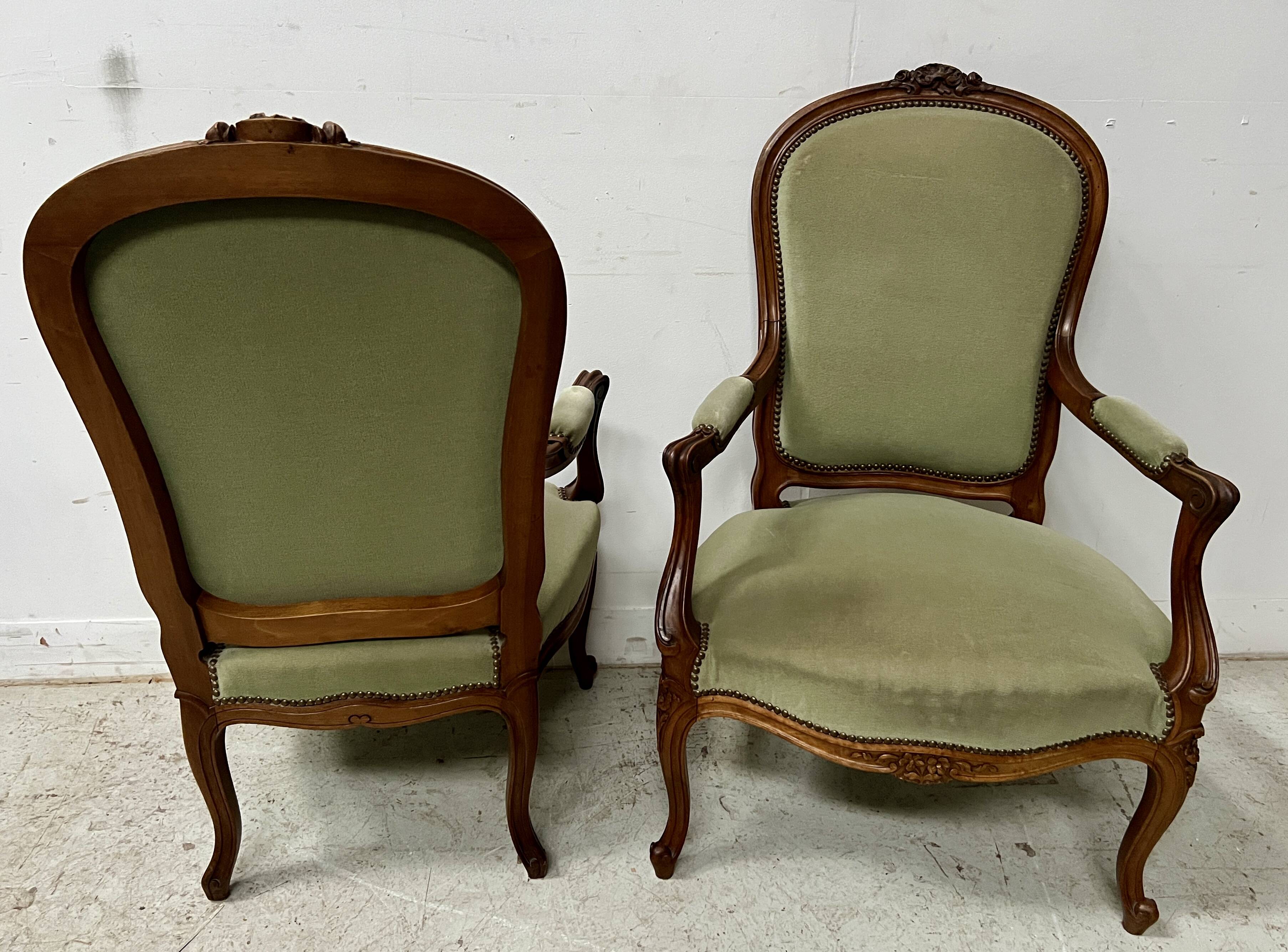 Pair of Louis XV style armchairs in solid walnut, 20th century.