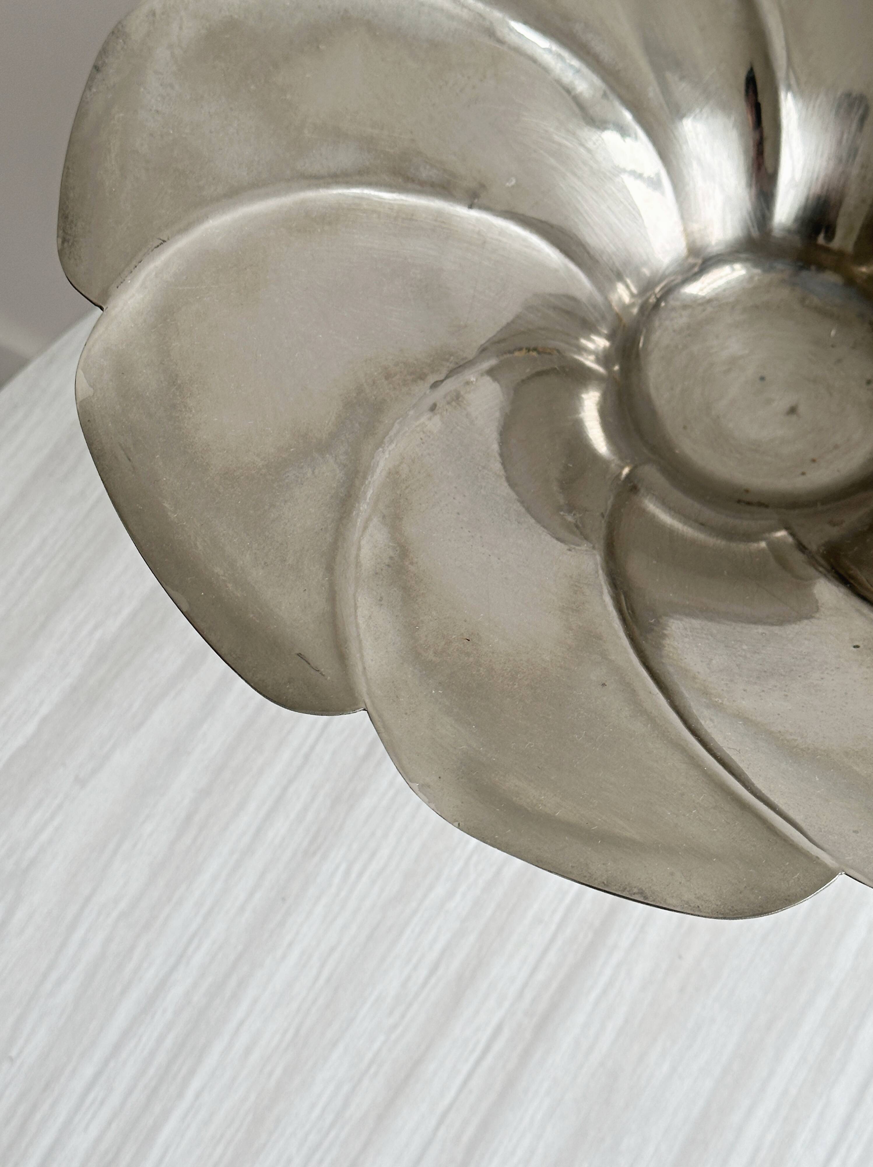 large dish on a shiny metal stand