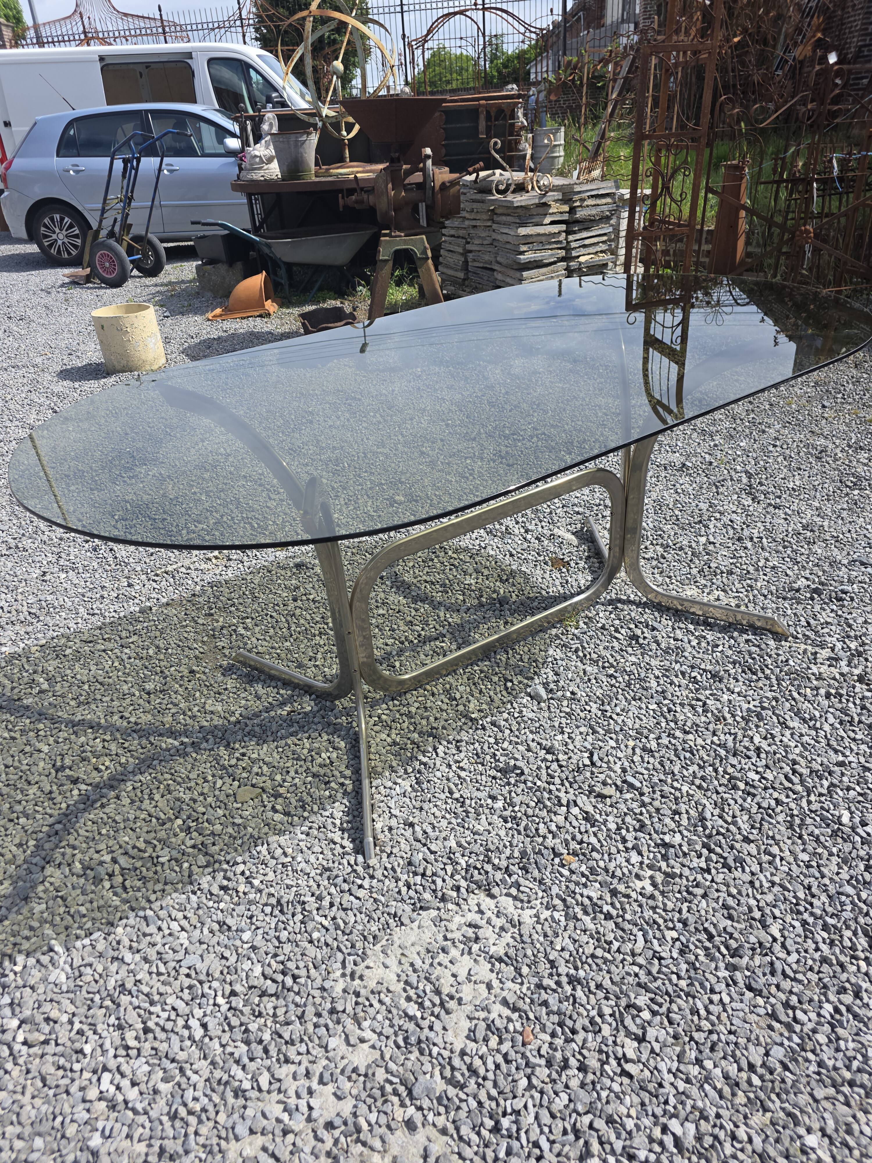 Silver metal table with smoked glass top from the 1970s.