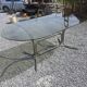 Silver metal table with smoked glass top from the 1970s.