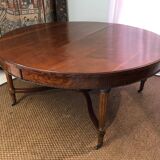 Important central pedestal table in mahogany, brass and bronze that can form a large dining table.