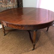 Important central pedestal table in mahogany, brass and bronze that can form a large dining table.