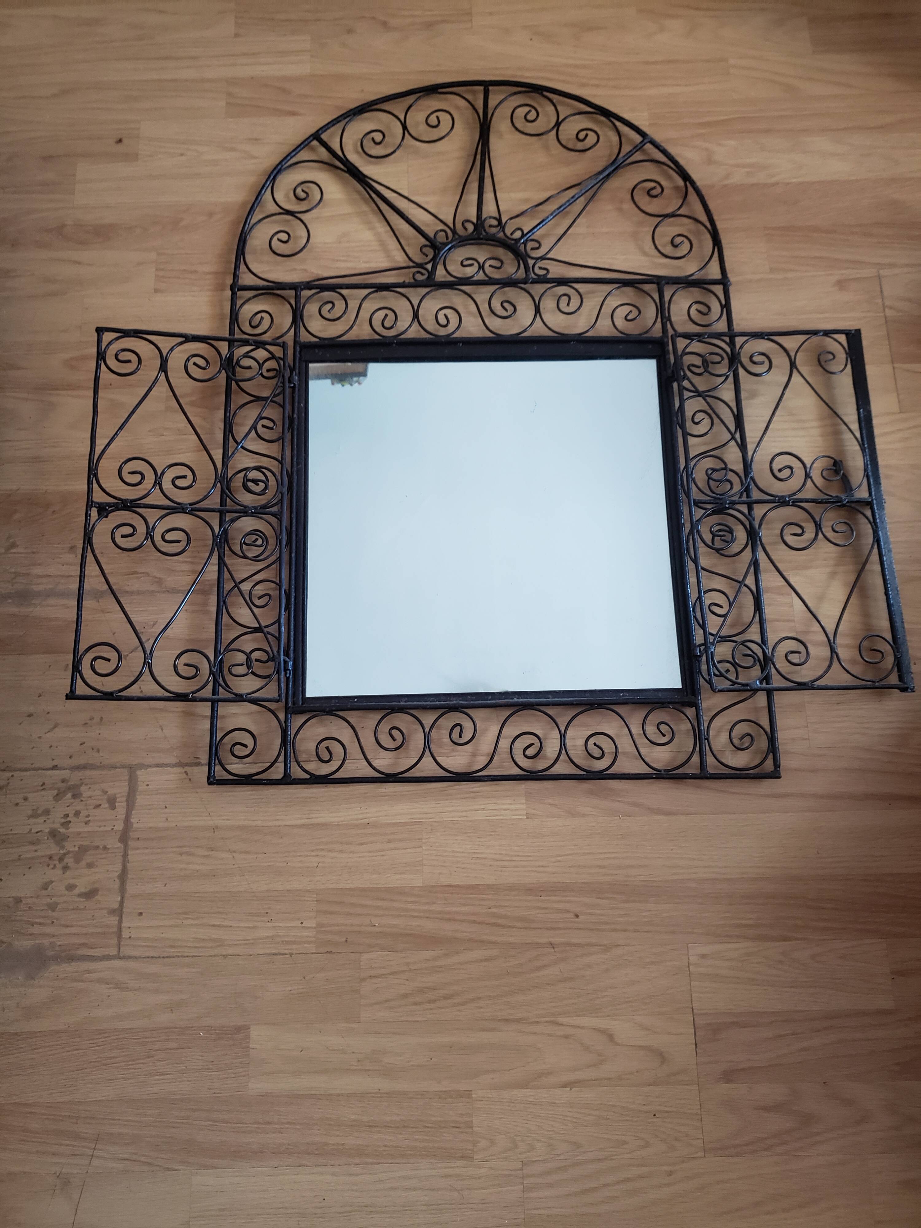 Oriental mirror with wrought iron door