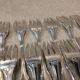 12 silver-plated metal cake forks by Argental silversmiths with a decorative pattern