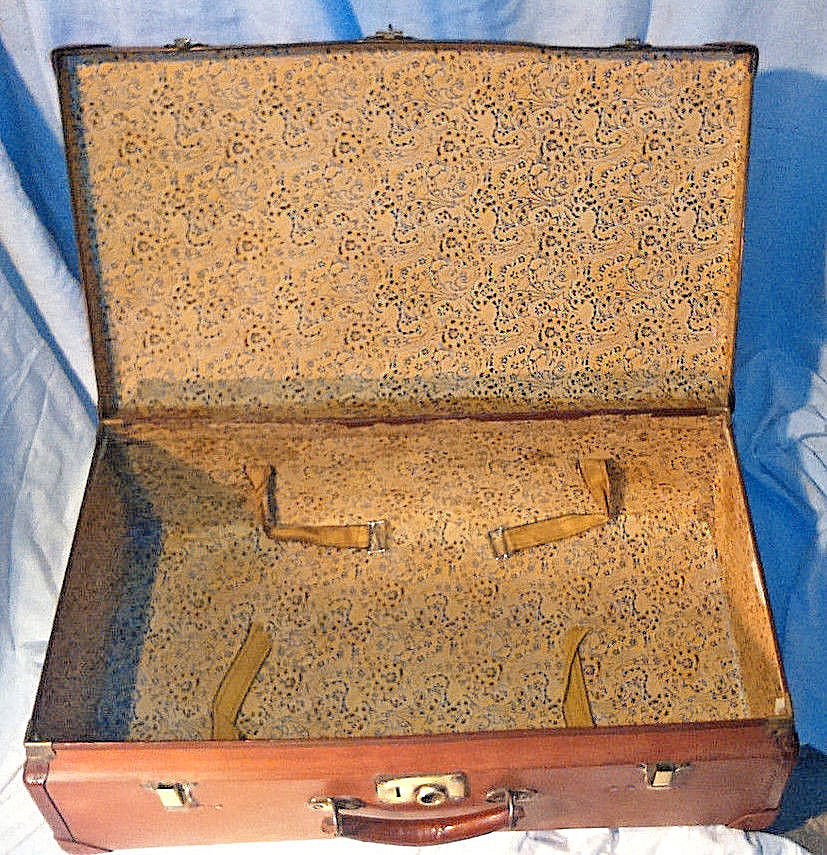 Old vintage black and white cardboard storage suitcase travel
