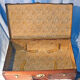 Old vintage black and white cardboard storage suitcase travel