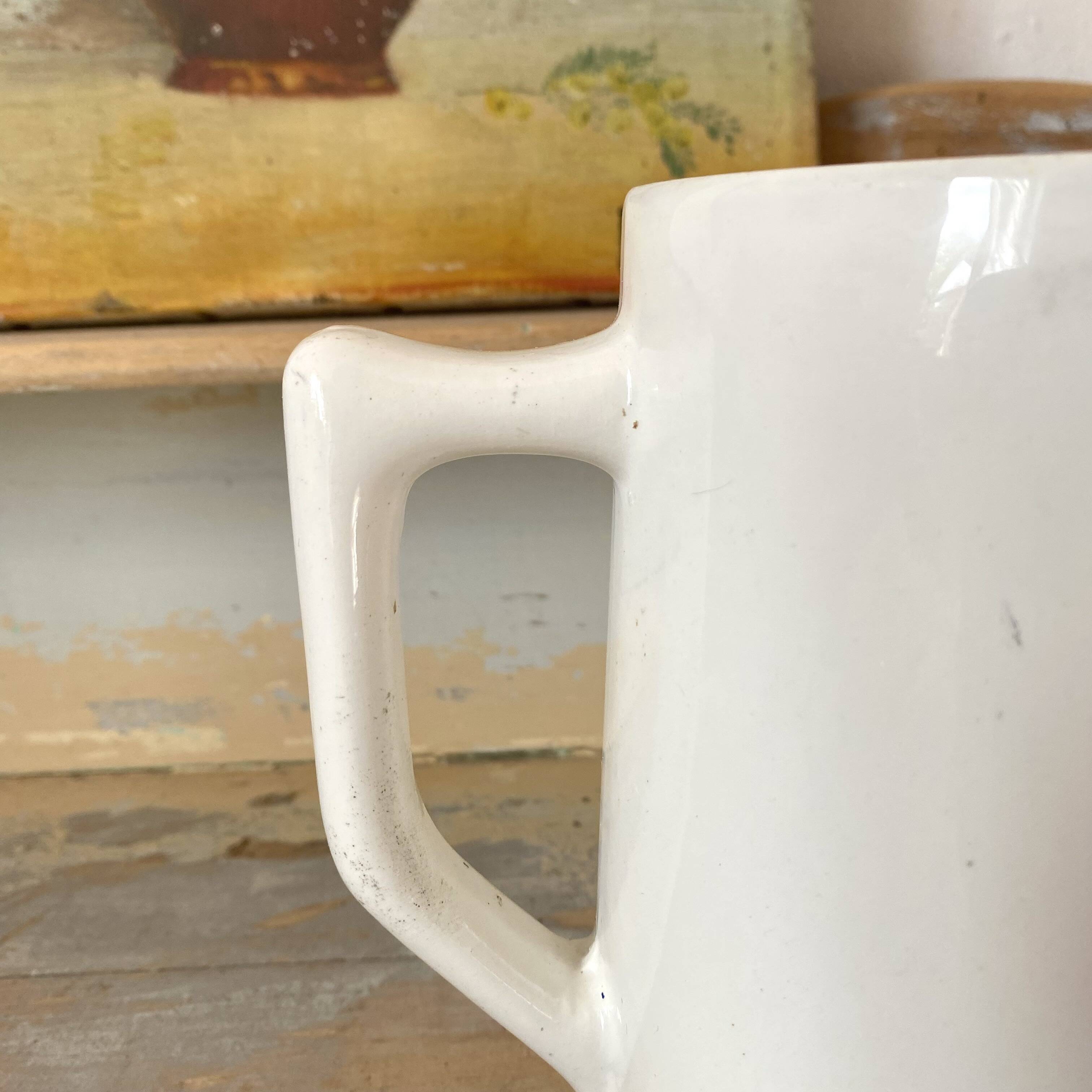 Old white earthenware jug