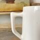 Old white earthenware jug