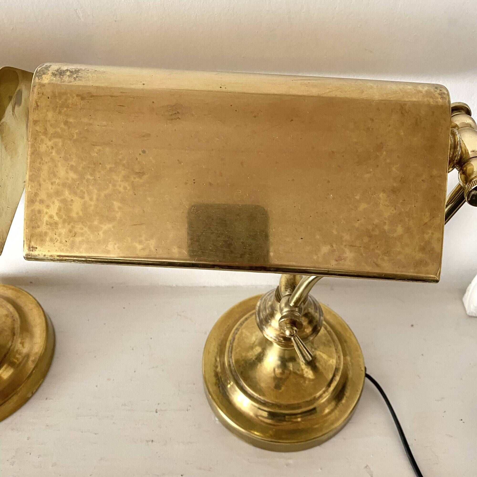Pair of notary-style lamps in gilded metal