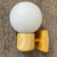 Vintage wall light in solid beech and opaline from the 70s-80s.