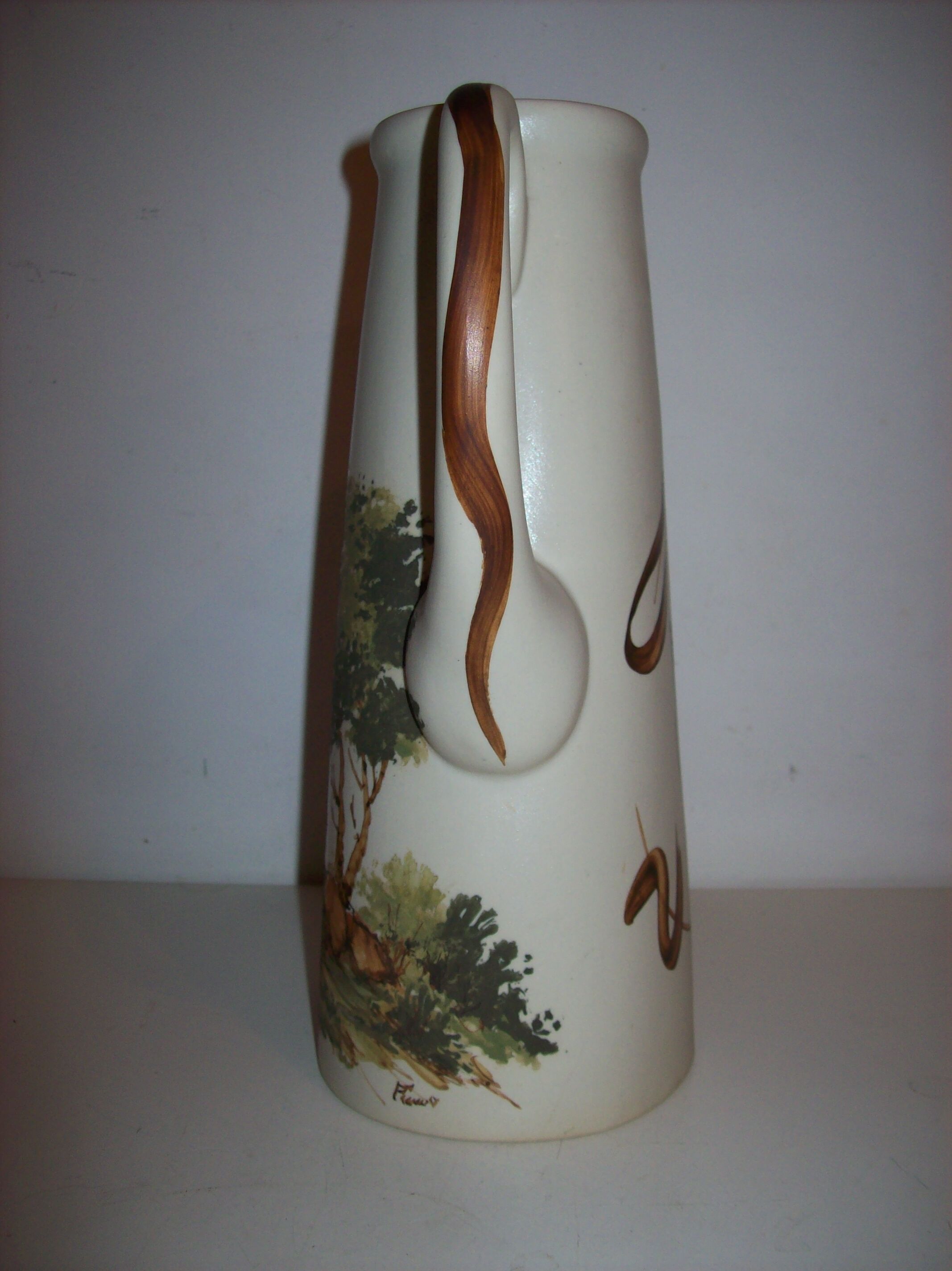 Ceramic pitcher with hand-painted decoration