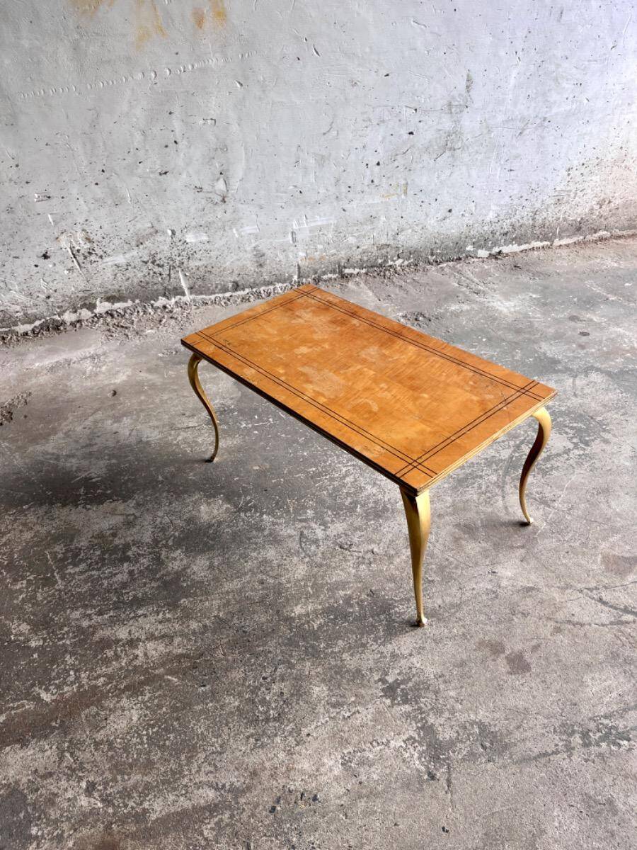 Mid-century wooden coffee table with golden metal legs and black-lined tabletop, 1950s