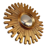 Old large golden sun mirror with rounded witch's eye in vintage resin from the 70s