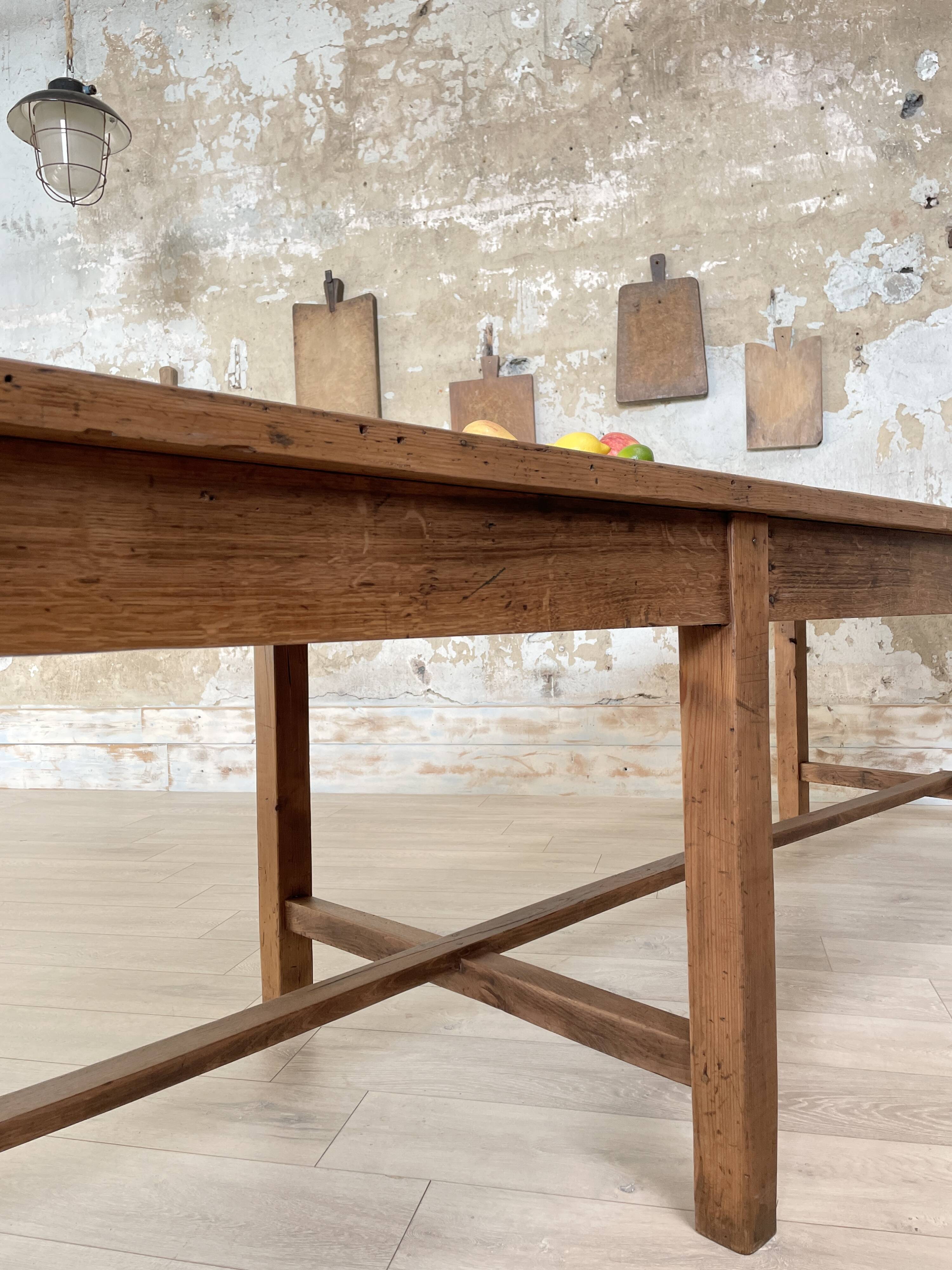 Solid wood workshop table with straight legs.