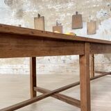 Solid wood workshop table with straight legs.