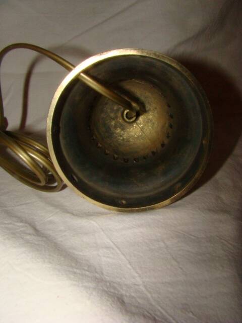 bronze bedside lamp with a pink cracked glass shade