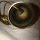 bronze bedside lamp with a pink cracked glass shade