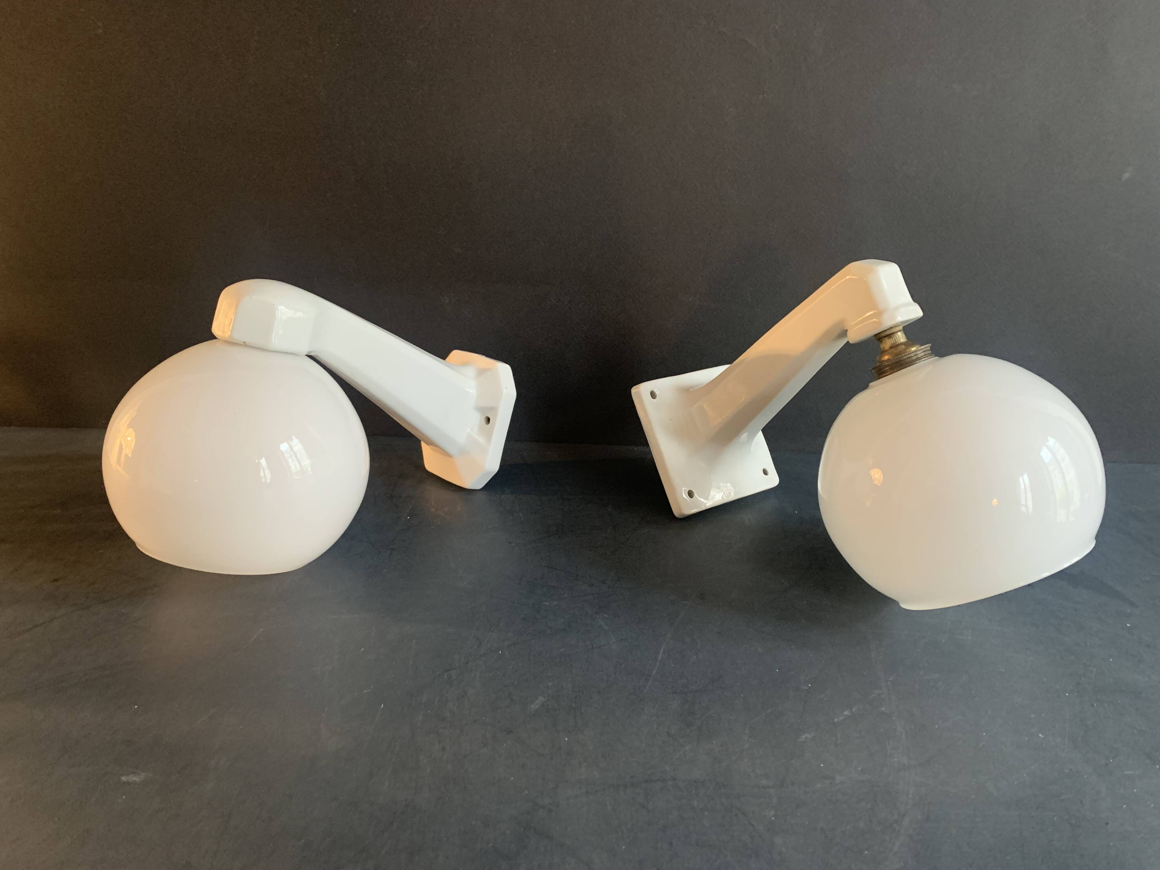 Pair of Art Deco porcelain wall lights with white Opaline globes, 1920