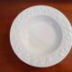 Set of 6 white ceramic deep plates made in Italy.