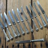Set of 12 dessert knives in silver metal with steel blades from the early 20th century
