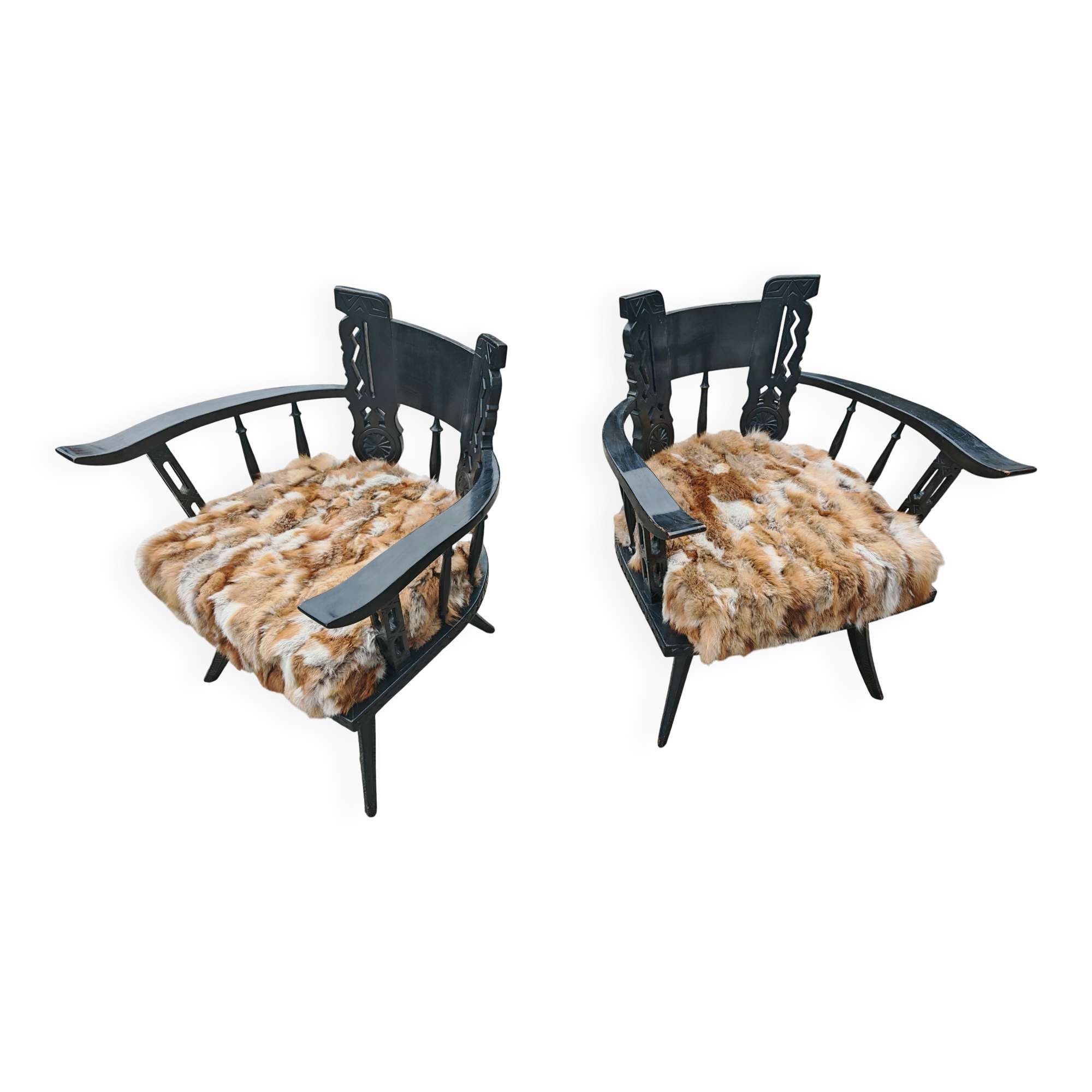Pair of hand-carved armchairs in black lacquer and fur, 1920s.