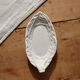 Antique leaf-shaped white English slipware dish.