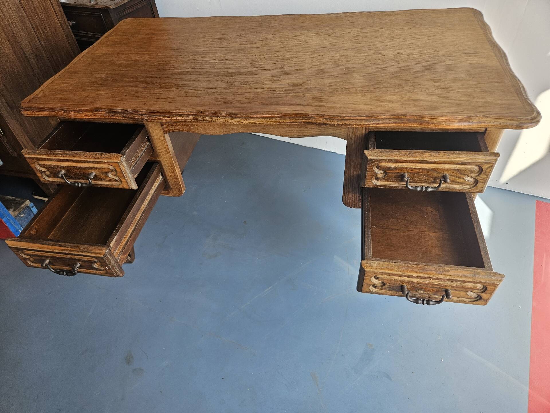 Antique wooden desk with 4 drawers.