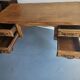 Antique wooden desk with 4 drawers.
