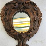 Ancient mirror in carved wood, vintage decoration