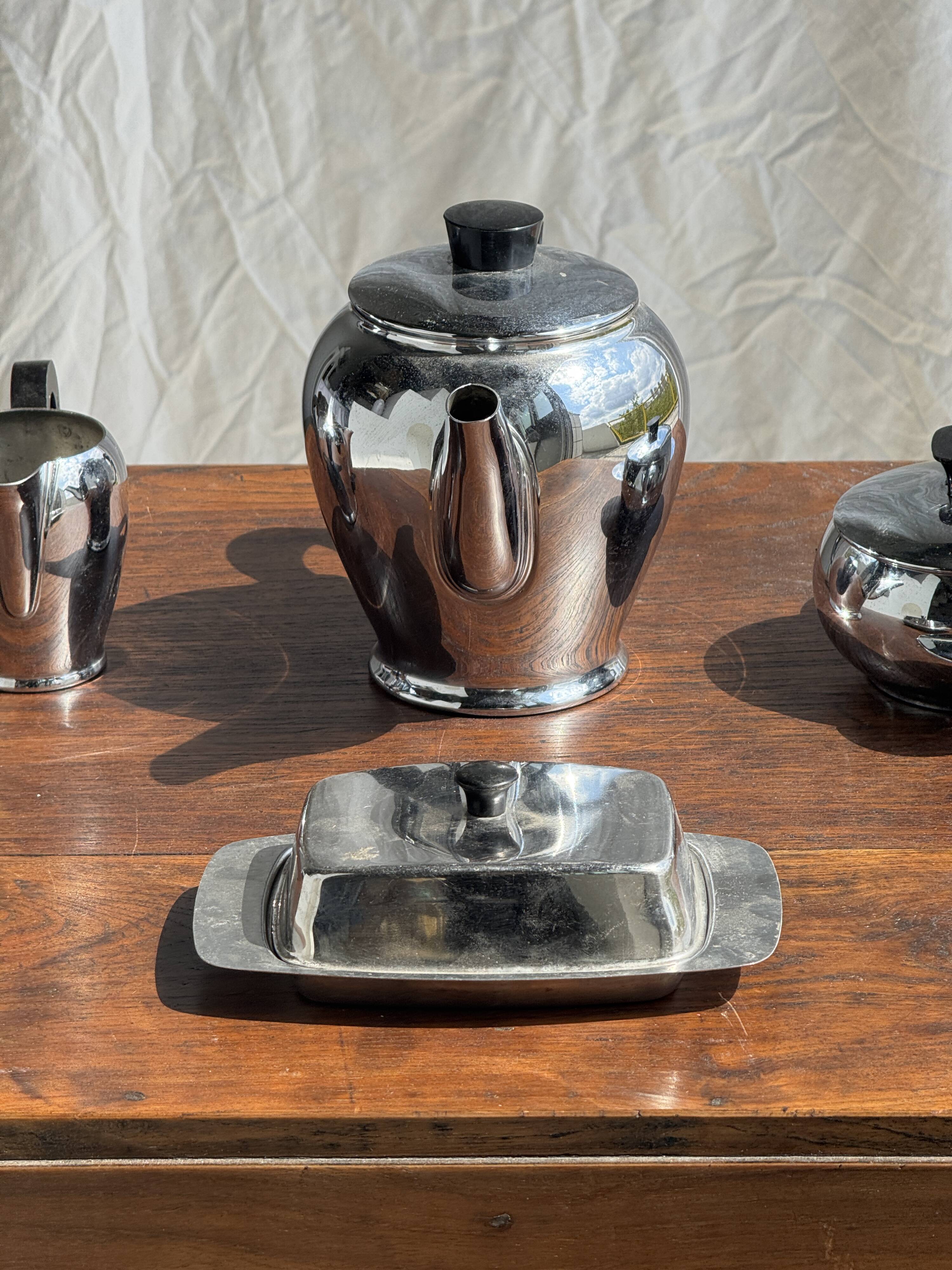 Tea set including teapot, milk jug, sugar bowl and butter dish