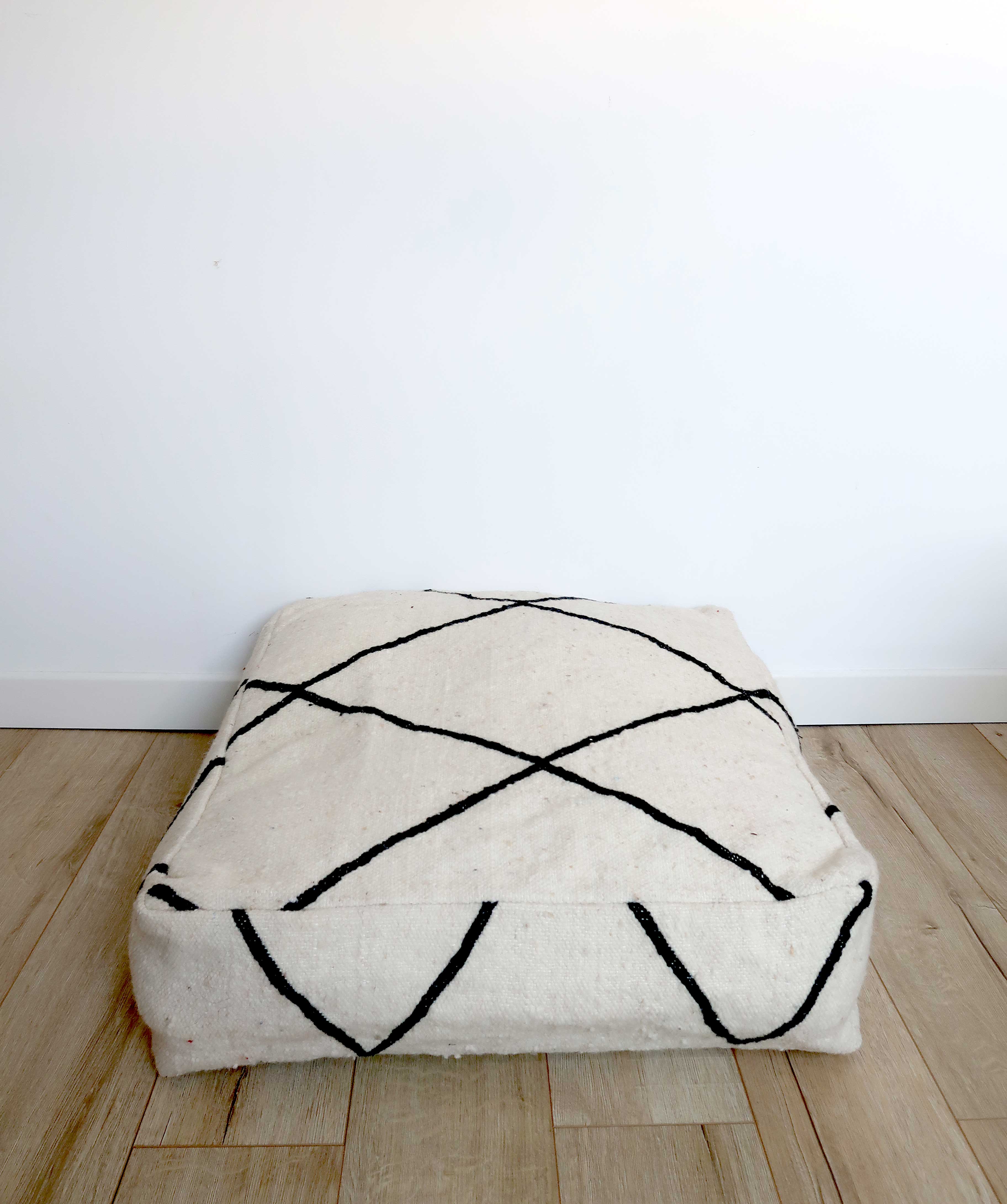 Black and white Berber ottoman cover with diamonds