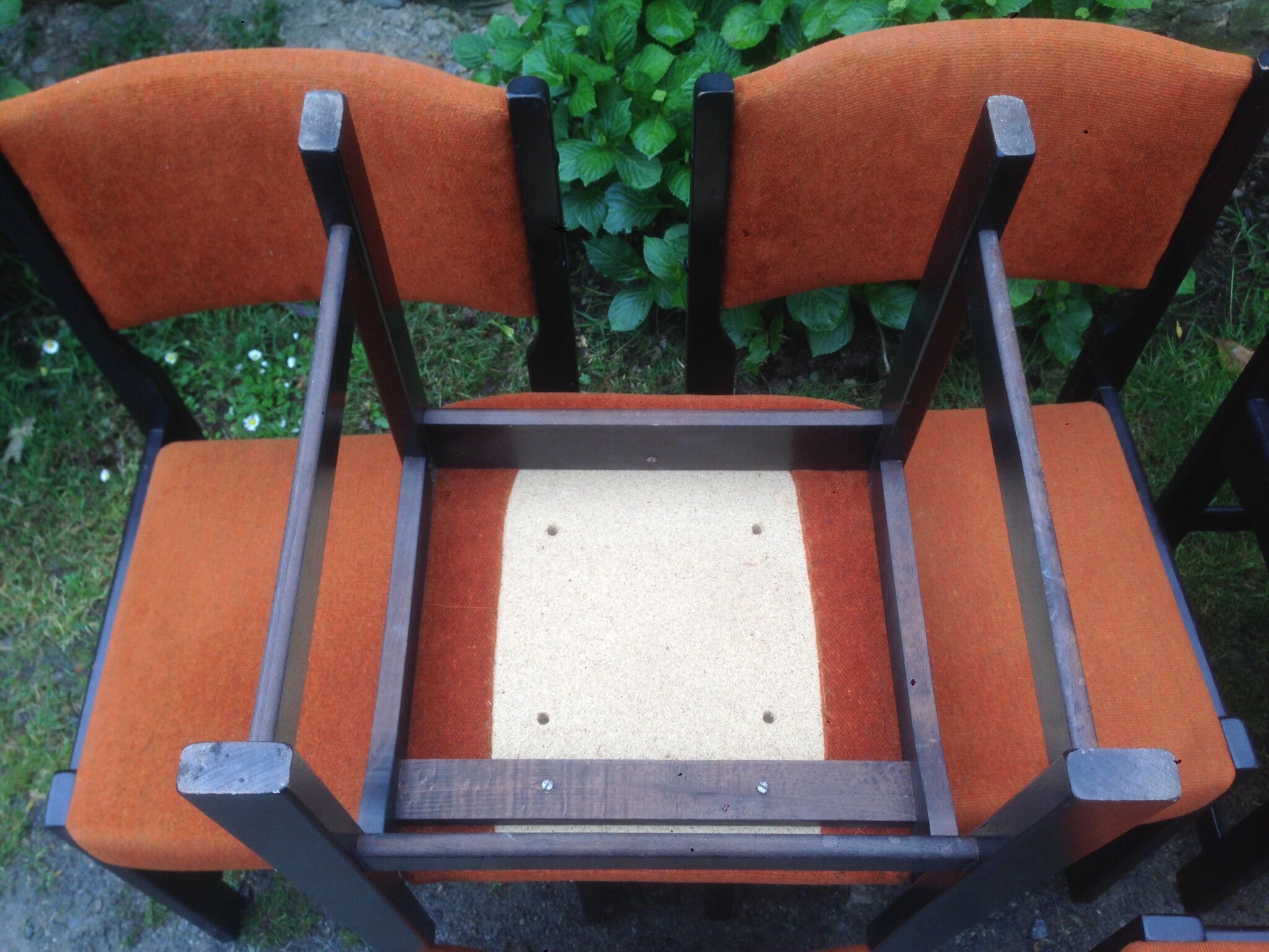 Series of 6 vintage chairs in orange fabric and black lace-up.