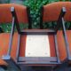 Series of 6 vintage chairs in orange fabric and black lace-up.