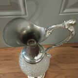 Old ewer in crystal and silver metal