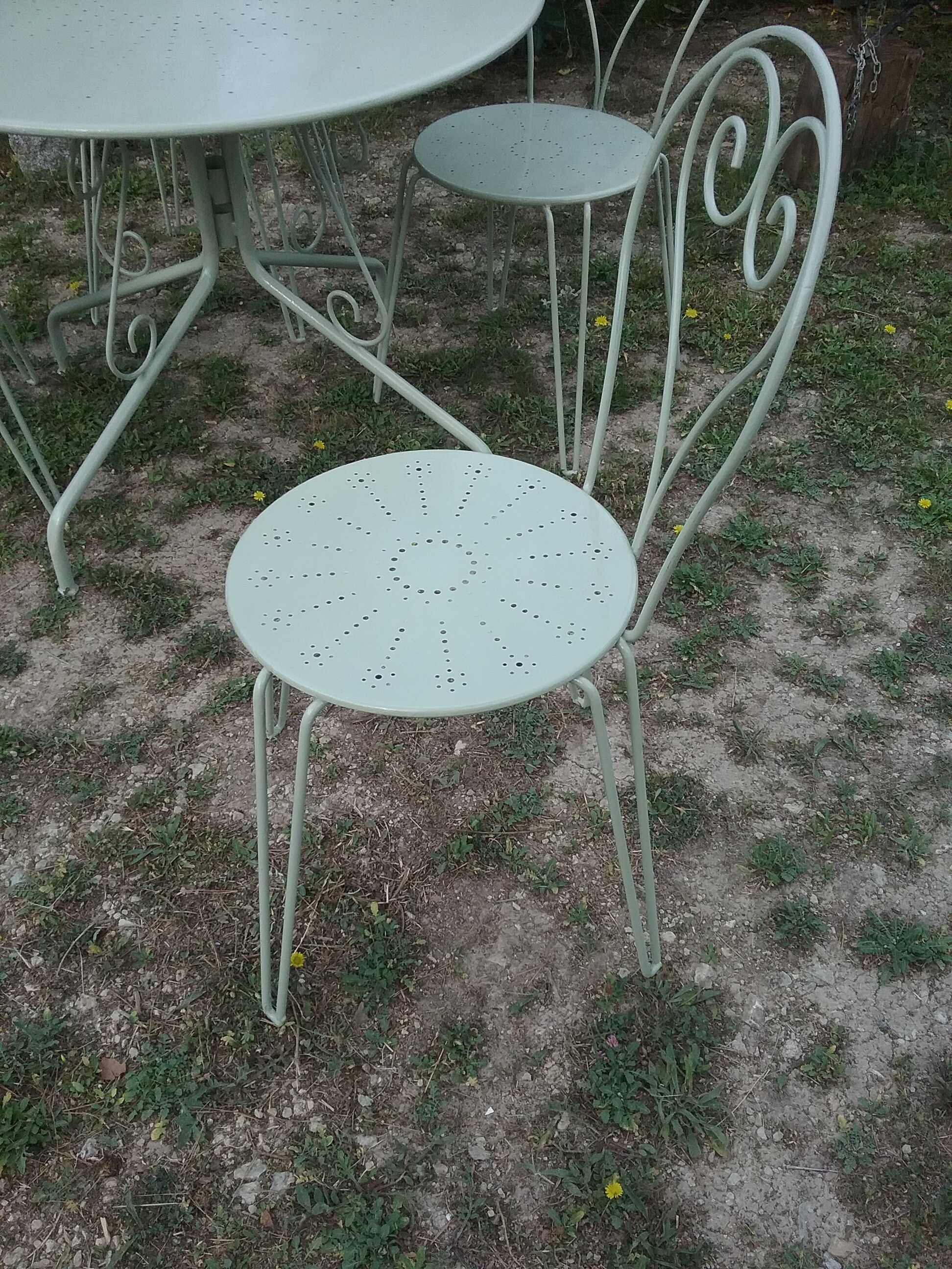 Green wrought iron garden furniture