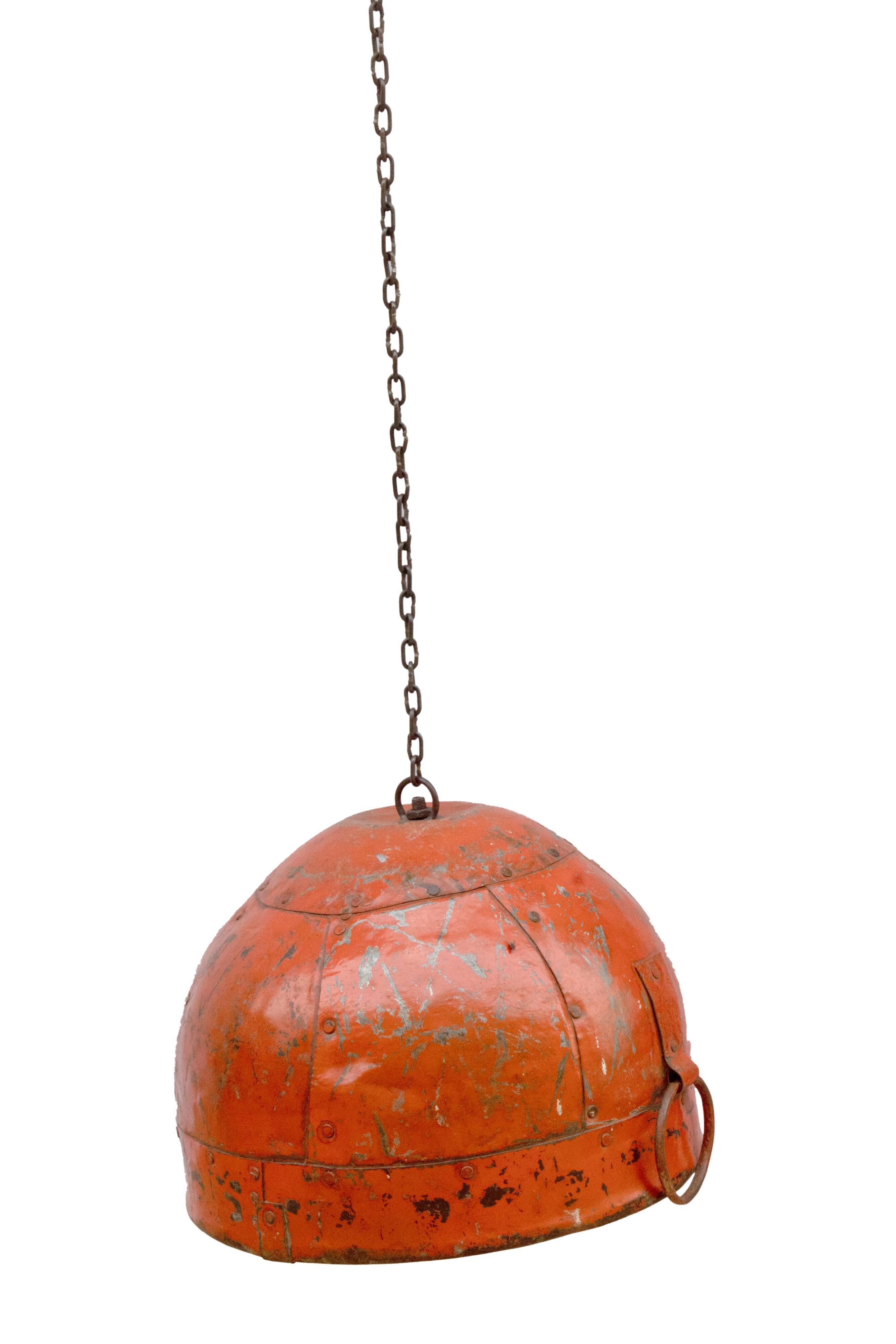 Metal hanging with its original red colour