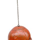 Metal hanging with its original red colour