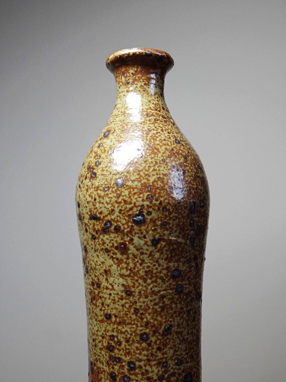 Tall bottle or soliflore in vintage handcrafted enamelled pyrite stoneware from the 60s and 70s