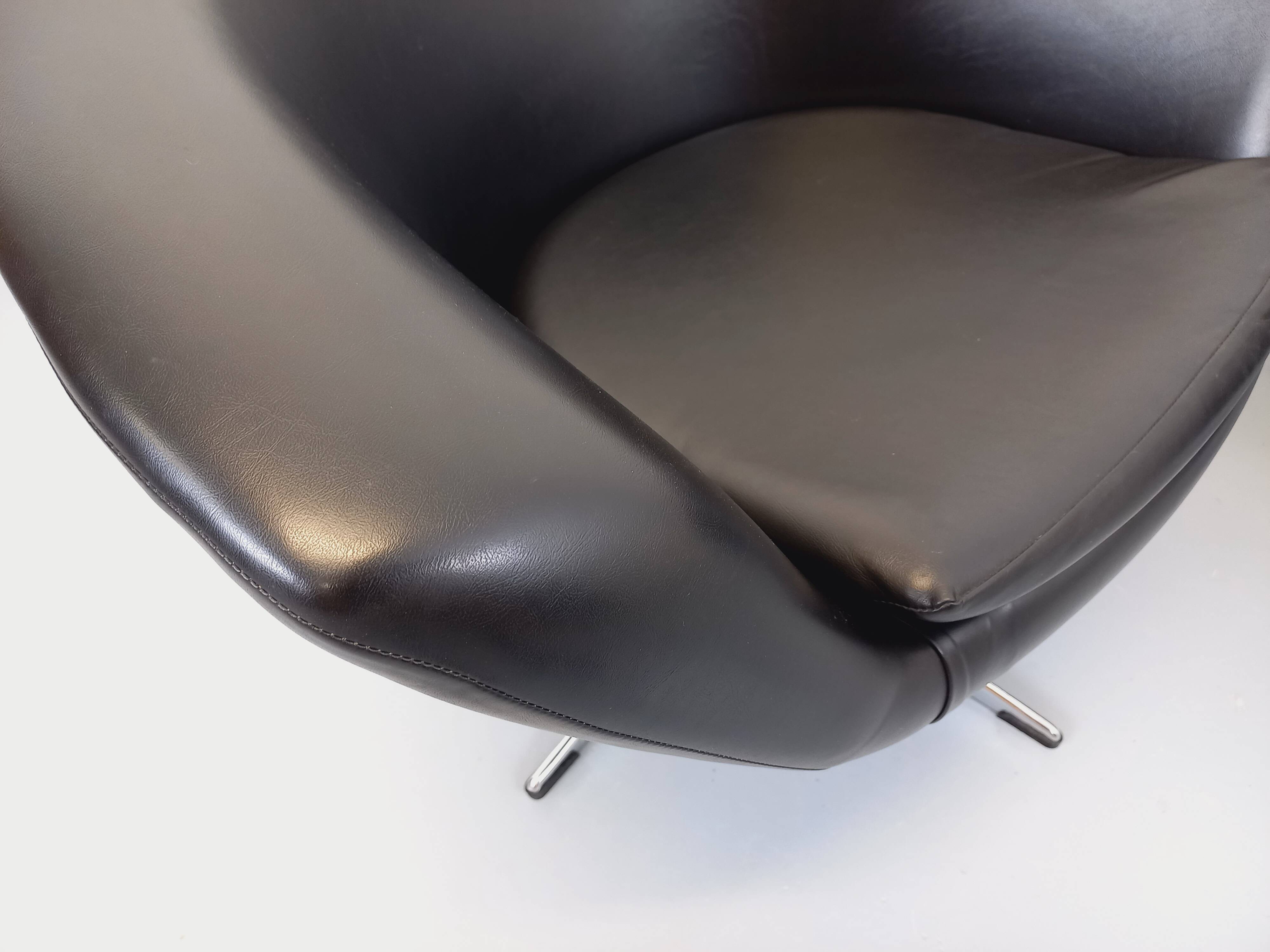 Pair of vintage Scandinavian swivel armchairs in faux leather and chrome.