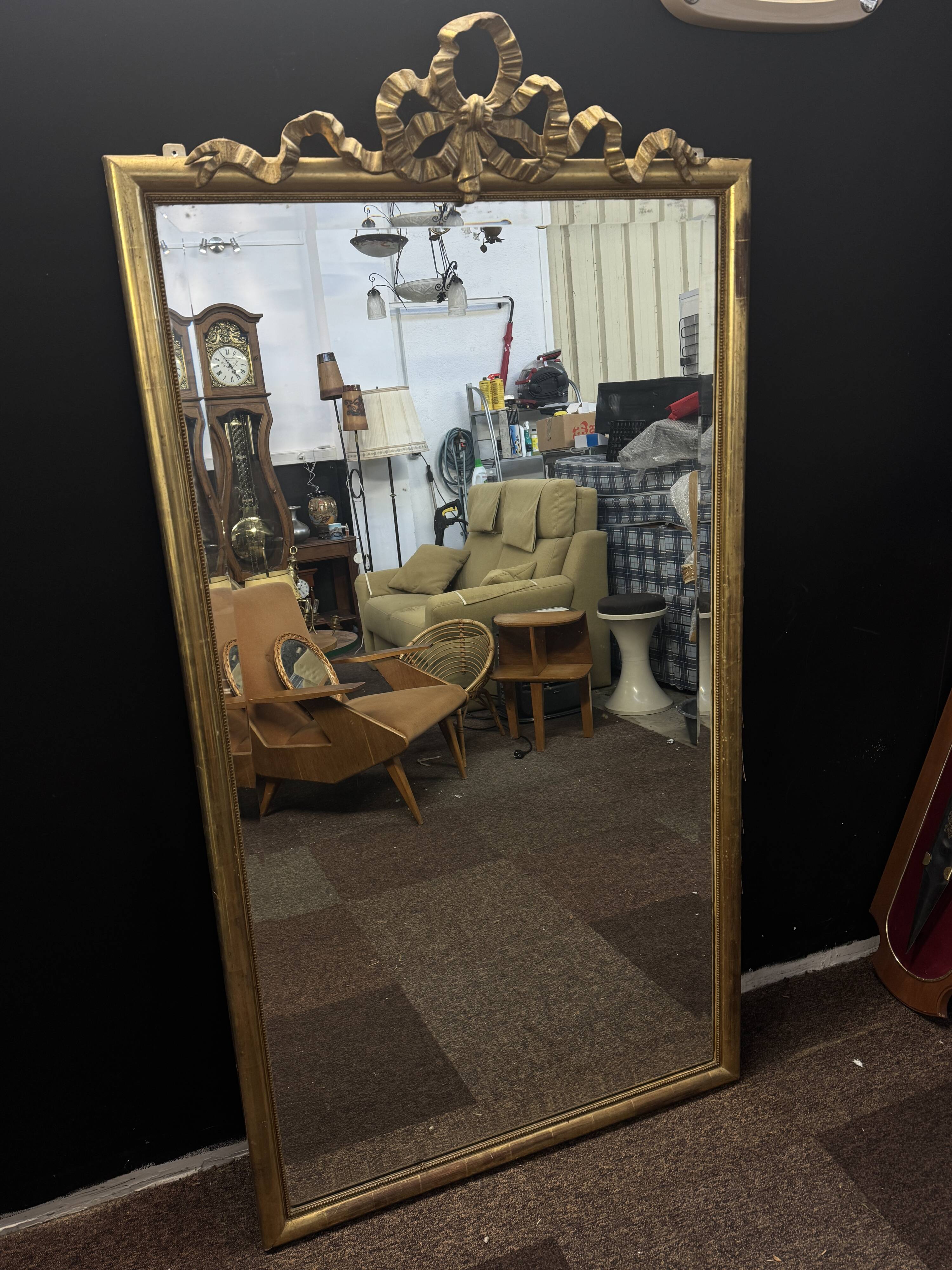 Large mirror with a gold frame