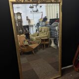 Large mirror with a gold frame
