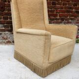 Fauteuil en velour beige et franges
