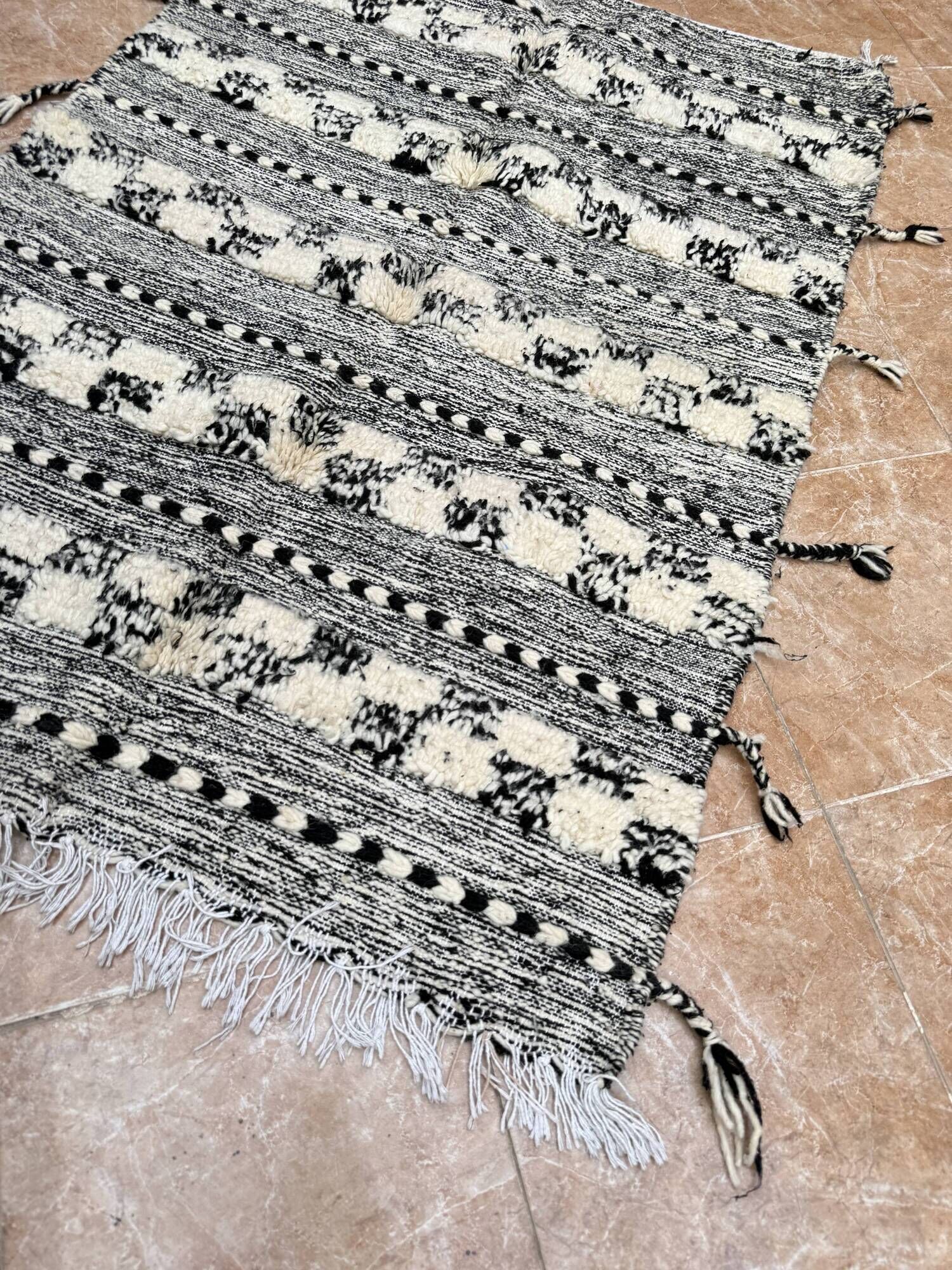 Small black Moroccan Berber Zanafi kilim rug for bedroom and living room.