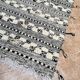 Small black Moroccan Berber Zanafi kilim rug for bedroom and living room.