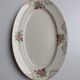 Oval plate Sarreguemines cream with pink gilding, antique.